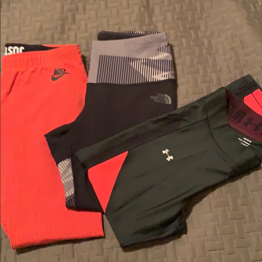 3 pairs leggings. Nike. Under Armour. North face.
